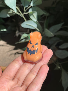 Orange jack-o’-lantern frogs
